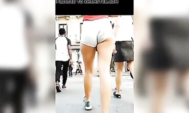 Tanned Babe Shows Off Cheeky Booty in Brief Cut-Offs