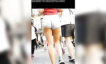 Tanned Babe Shows Off Cheeky Booty in Brief Cut-Offs