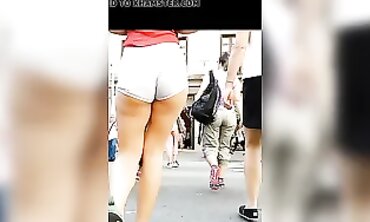 Tanned Babe Shows Off Cheeky Booty in Brief Cut-Offs
