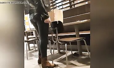 Sexy Cougar in Dark Green Leather Leggings with Cameltoe