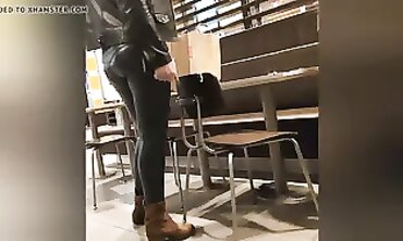Sexy Cougar in Dark Green Leather Leggings with Cameltoe