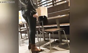 Sexy Cougar in Dark Green Leather Leggings with Cameltoe