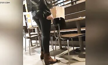 Sexy Cougar in Dark Green Leather Leggings with Cameltoe