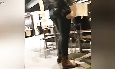 Sexy Cougar in Dark Green Leather Leggings with Cameltoe