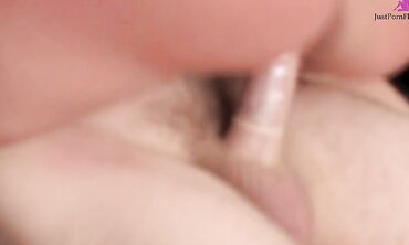 Young sex pot sucks and fucks dude on the couch.  Cum shot on tits.