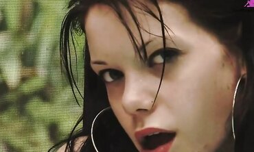 Auburn haired cutie in jacuzzi gets off on water jets and with dildo.