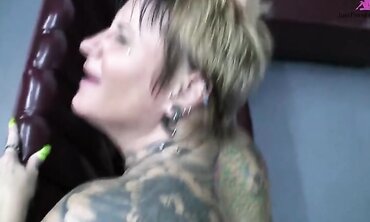 Heavily Tattooed And Pierced Biker Chick Black Widow Sucks And Fucks