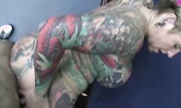 Heavily Tattooed And Pierced Biker Chick Black Widow Sucks And Fucks