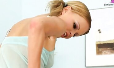 Sweet young blond removes her blue see-through lingerie then fucks herself into a frenzy.