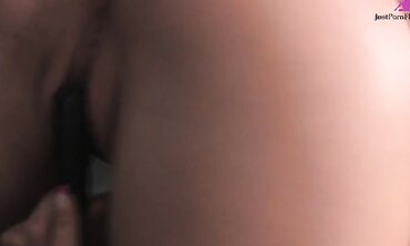 Raven haired cutie wearing high suede boots has great smiling orgasms with vibrator.