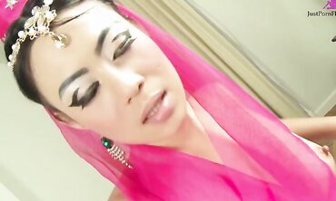 Passionate beauty in Thai costume dances striptease in front of her boyfriend and lets him fuck himself