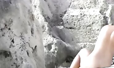Shaved milfs enjoy public nudity on the beach