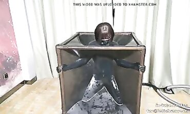 Japanese Fem Dom Cage Uses Vinyl Vacuum on Submissive