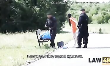 Rough Brunette Cop Gives Skinny Outlaw a Filthy Blowjob