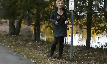 Mature Flasher Shows Off Lace Bodysuit On Boardwalk