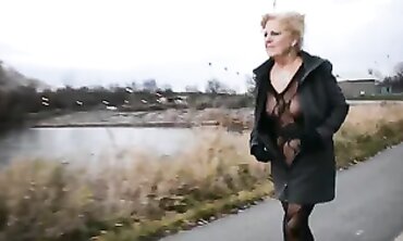 Mature Flasher Shows Off Lace Bodysuit On Boardwalk