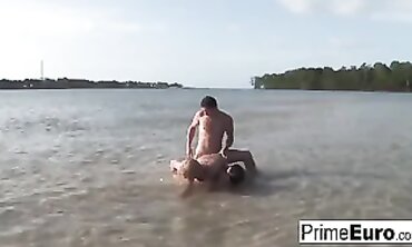 Barbie Banks Enjoys a Steamy Beach Threesome