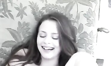 Iva Nora Fingers Her Trimmed Pussy While Sitting On A Chair