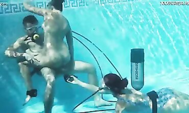 Candy and Lizzy Pounding Mike Underwater