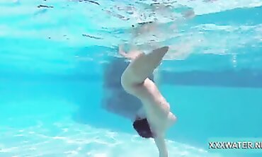 Dark-Haired Candy Shows Off Big Tits Underwater