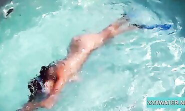 Dark-Haired Candy Shows Off Big Tits Underwater