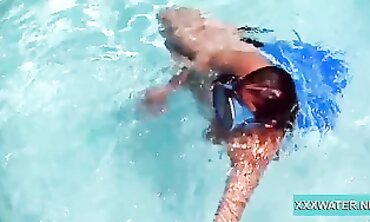 Dark-Haired Candy Shows Off Big Tits Underwater