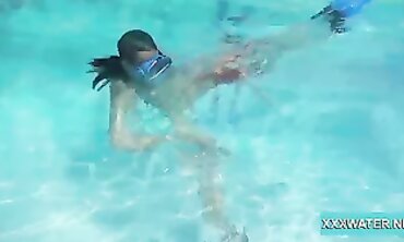 Dark-Haired Candy Shows Off Big Tits Underwater