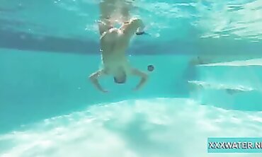 Dark-Haired Candy Shows Off Big Tits Underwater