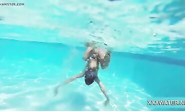 Dark-Haired Candy Shows Off Big Tits Underwater
