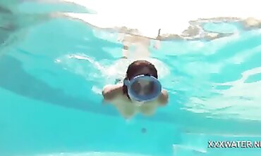Dark-Haired Candy Shows Off Big Tits Underwater