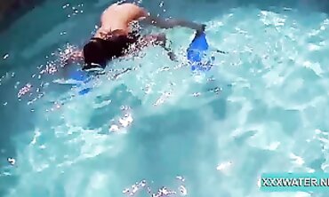 Dark-Haired Candy Shows Off Big Tits Underwater