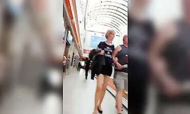 Mature Lady in Micro-Skirt and Nude Stockings Upskirt