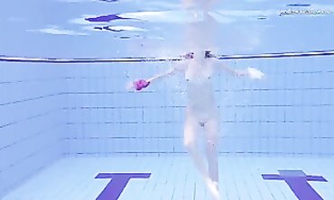 Elena Proklova Swims Nude in Bikini