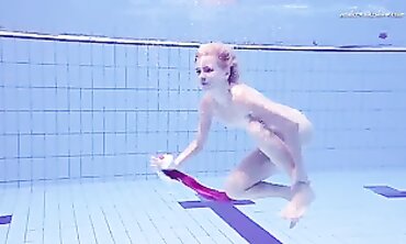 Elena Proklova Swims Nude in Bikini