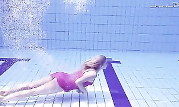 Elena Proklova Swims Nude in Bikini