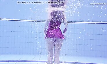 Elena Proklova Swims Nude in Bikini