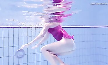 Elena Proklova Swims Nude in Bikini