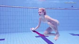 Elena Proklova Swims Nude in Bikini