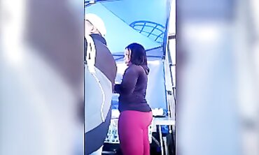 African Guy in Semitransparent Maroon Trousers