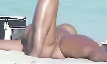 Naturista Beach Babe's Sun-Kissed Body" or "Sunny Day at Naturism Paradise", this SEO optimized video is about exploring nudity in public on beautiful beaches with stunning views of nature around