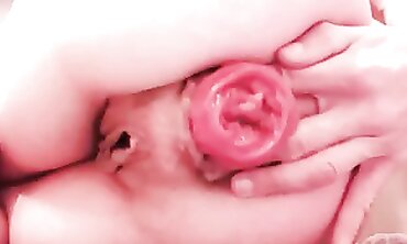 Slender Marionette Fists and Plays with Her Blossom