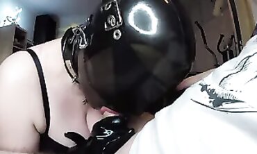 Miss Maskerade with vinyl Rubber hood Gives a Intense Oral job Hook-up to Sir Sam