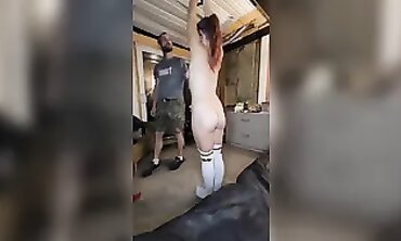 Dominatrix uses her favorite sex toy on submissive slave's ass
